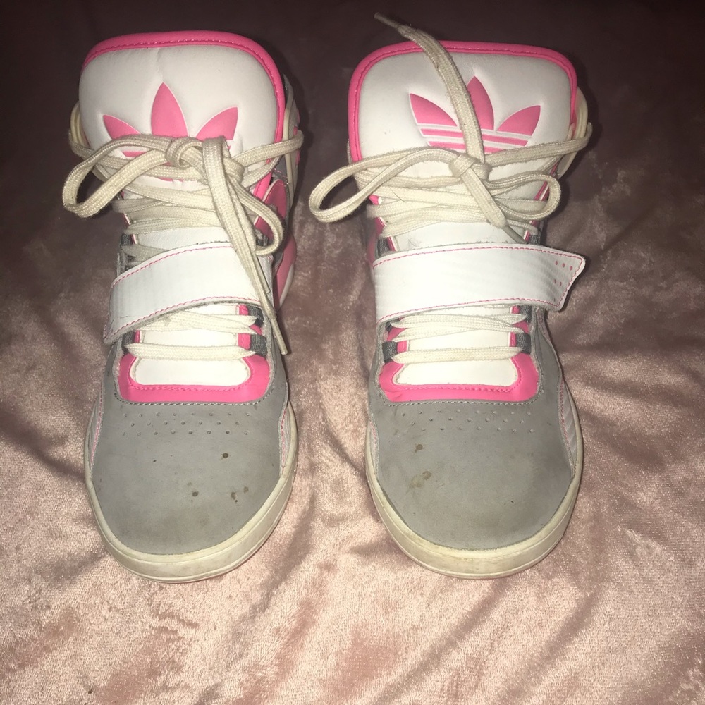 Worn pink and grey adidas